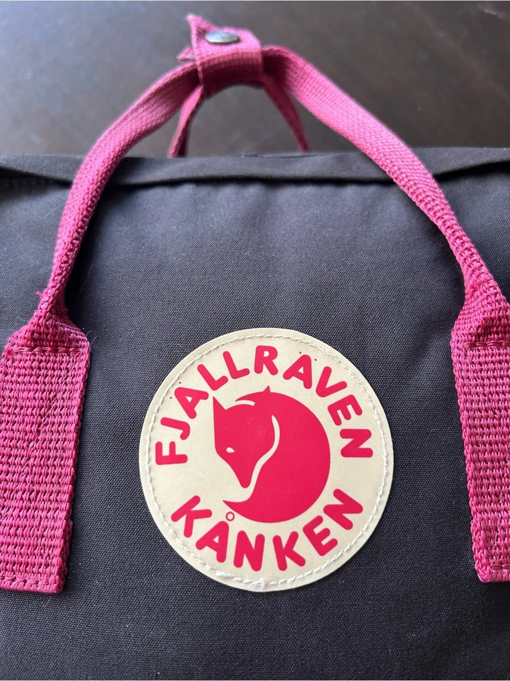 Fjallraven Black Backpack with Red Handles